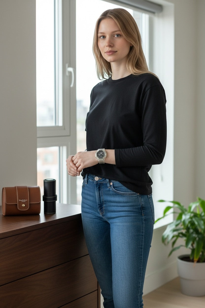 TimelessPieces by Marcel transparent Casio G-Shock GA-2100 watch on a woman's wrist, featuring analog-digital display.